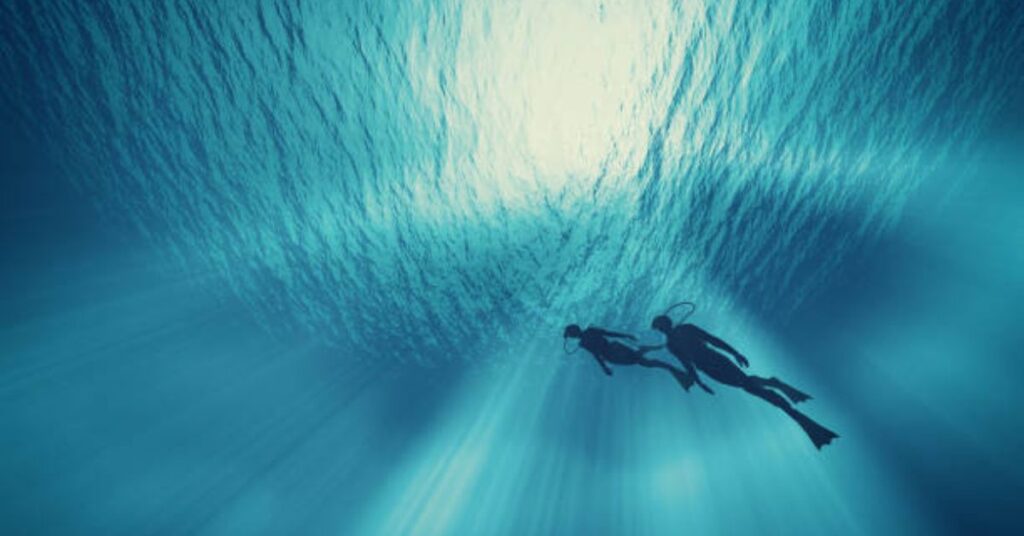 Open Water Diver exploring a shipwreck at 18 meters depth