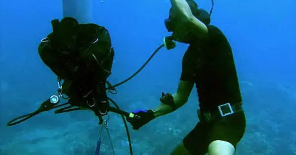 Scuba diver preparing Buoyancy Control Device (BCD) for underwater adventure